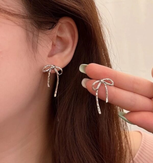 Bow silver stud earrings