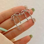 Bow silver stud earrings